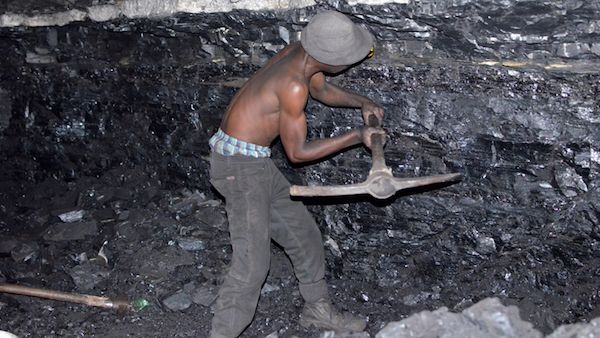 Person worker digging and mining for gold Vector Image