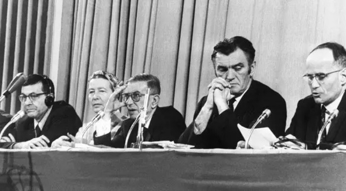 Simone de Beauvoir and Jean-Paul Sartre, center, participating in a tribunal that determined the United States had violated human rights and international law in Vietnam.